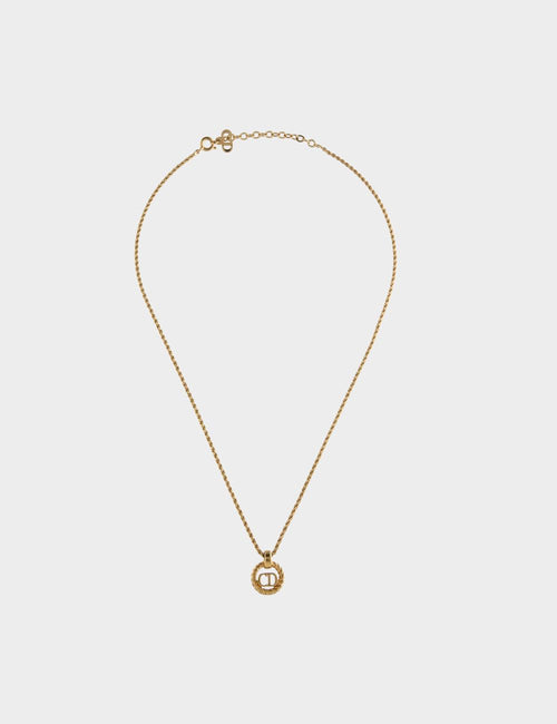 Christian Dior gold necklace with textured circular CD logo pendant and delicate chain