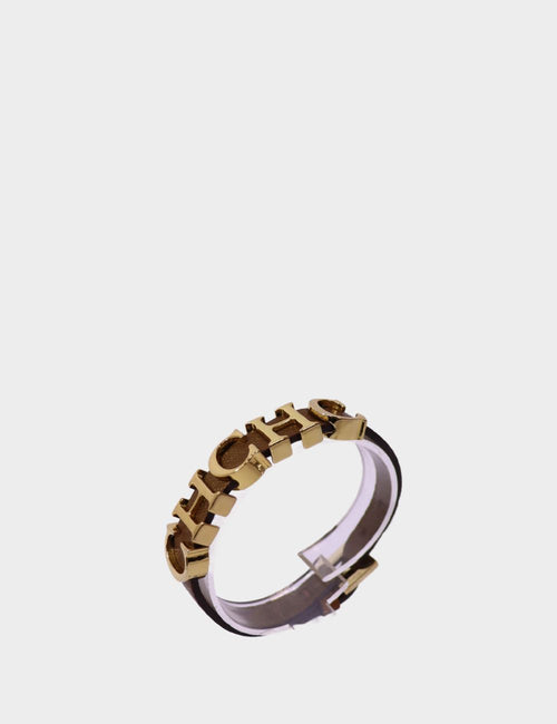 Pre-owned Carolina Herrera gold-tone cuff bracelet with raised CH logo letters