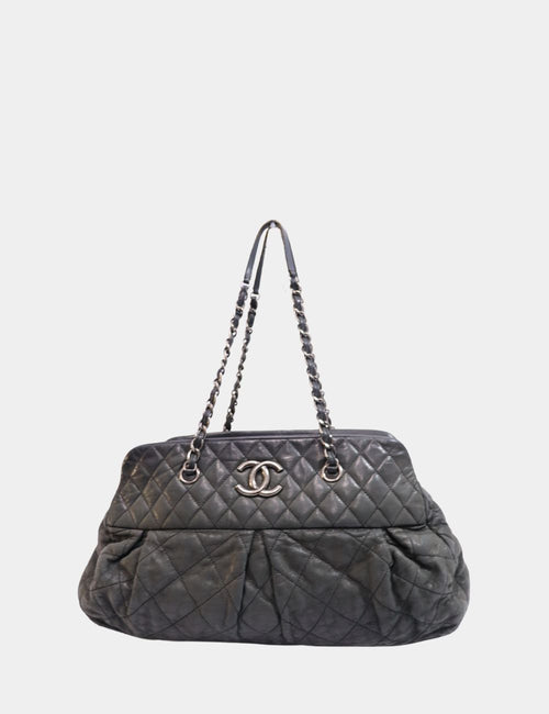 Chanel black quilted leather tote bag with silver CC logo and chain shoulder straps