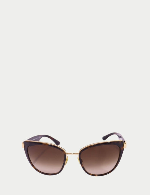 Dolce & Gabbana tortoiseshell cat-eye sunglasses with gold accents and brown gradient lenses