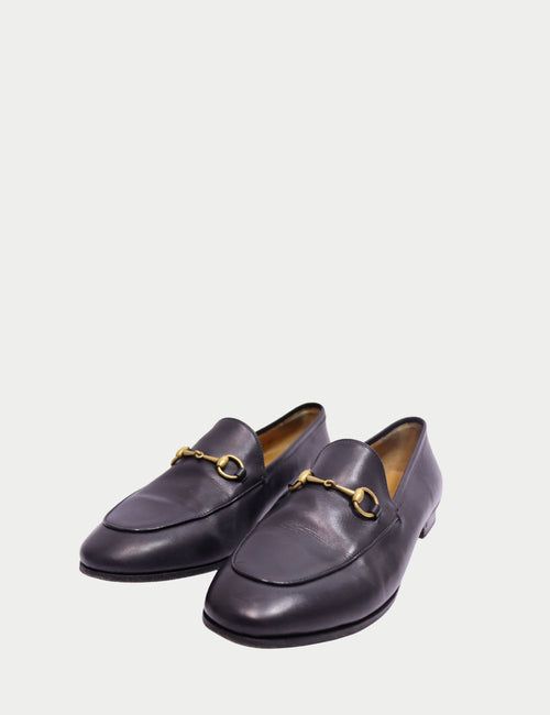 Gucci black leather horsebit loafers with gold hardware front view
