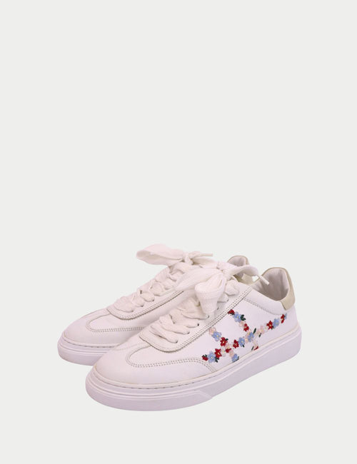 Hogan white leather sneakers with multi-color floral embroidery and chunky sole.