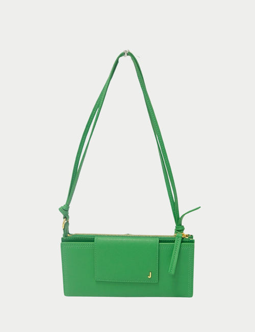 Jacquemus Le Bambino Long green leather shoulder bag with gold-tone J logo and adjustable strap.