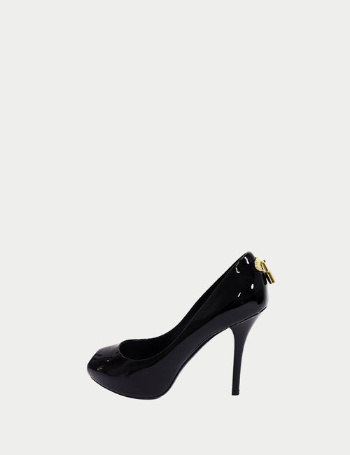 Louis Vuitton black patent leather stiletto pumps with gold padlock detail at heel