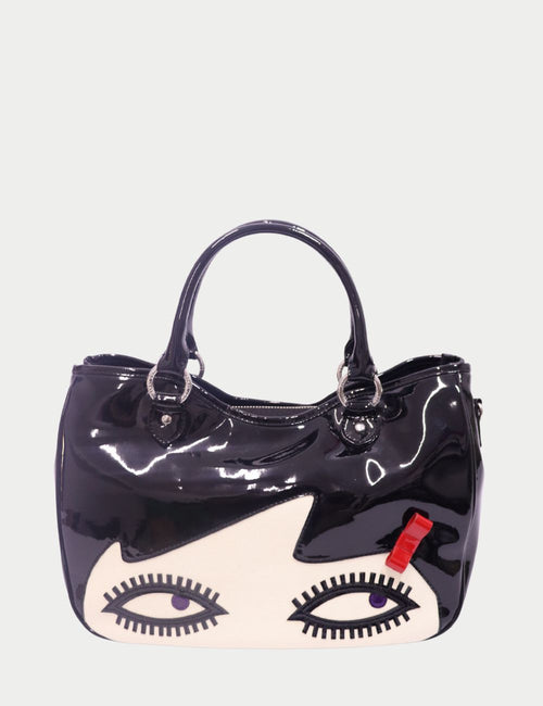 Lulu Guinness black patent leather tote with face motif and red bow detail