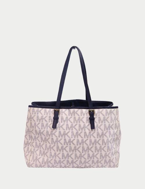 Michael Kors ivory monogram tote bag with navy leather straps and gold hardware
