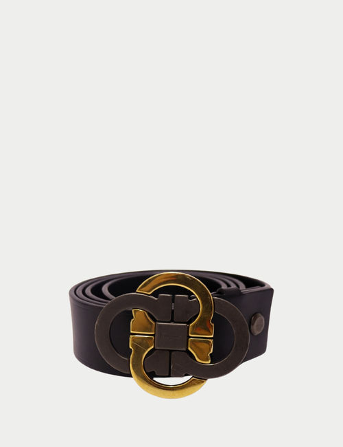 Salvatore Ferragamo black leather belt with signature dual Gancini buckle in gold and gunmetal finish