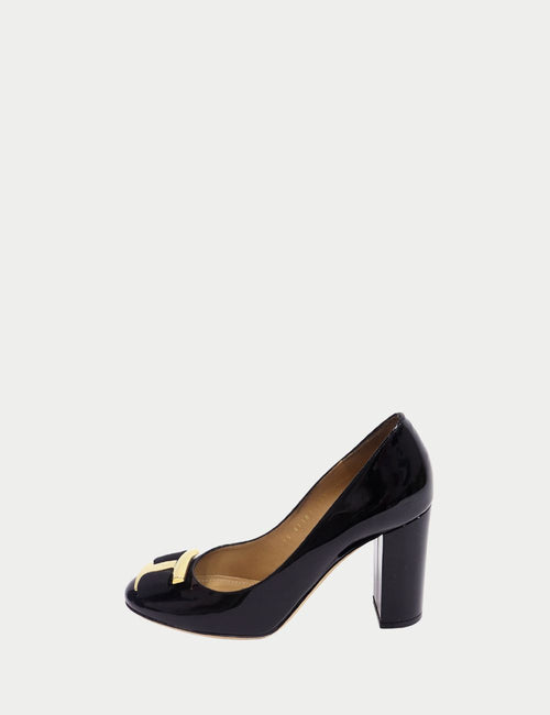 Salvatore Ferragamo black patent Vara pumps with gold logo plaque and grosgrain bow