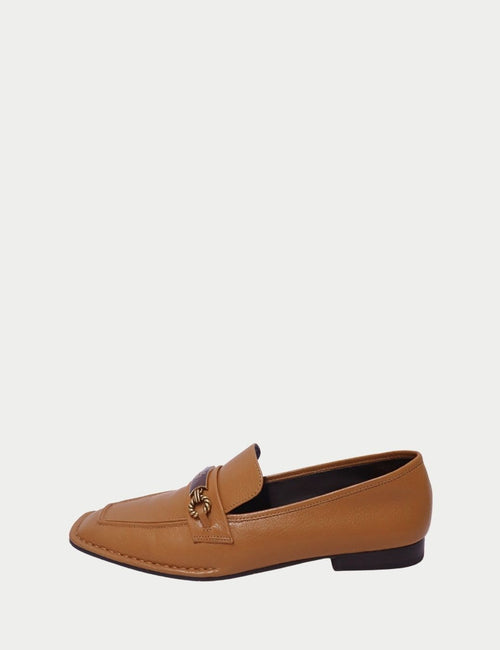 Tory Burch camel leather loafers featuring gold logo hardware and square toe design