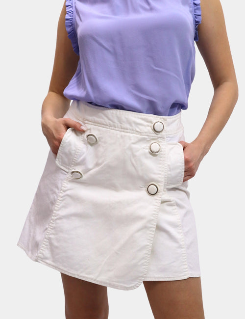 Dolce & Gabbana white cotton mini skirt with asymmetric wrap front and oversized button detail.