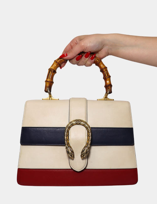 Gucci Dionysus tricolor leather bag with bamboo top handle and signature Dionysus tiger-head clasp.