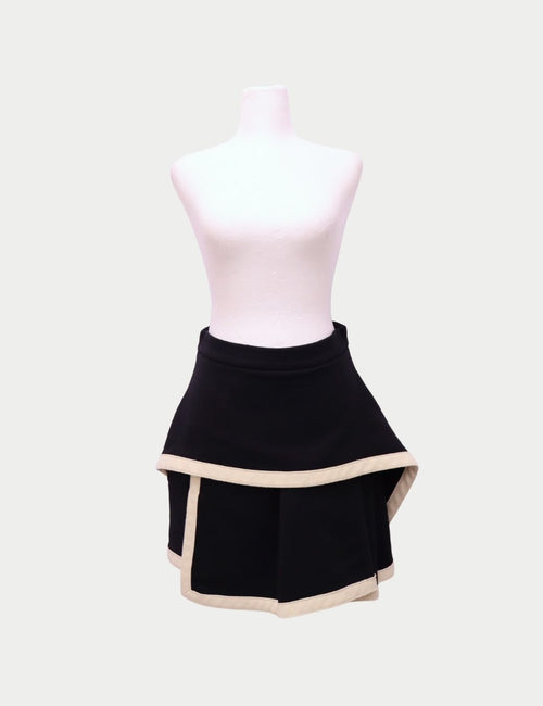 Alexander McQueen black layered mini skirt with asymmetric hem and contrast beige trim