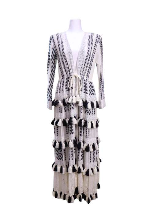 Alice + Olivia black and white bohemian maxi cardigan featuring geometric patterns, lace trim details, tassel embellishments, long sleeves, and an adjustable waist tie