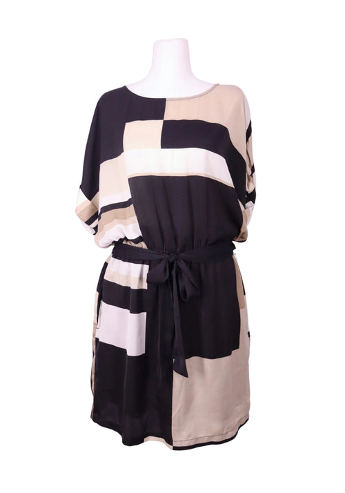 DKNY short sleeve dress in a silky, lightweight fabric featuring an abstract color-block pattern in black, beige, and soft blush tones