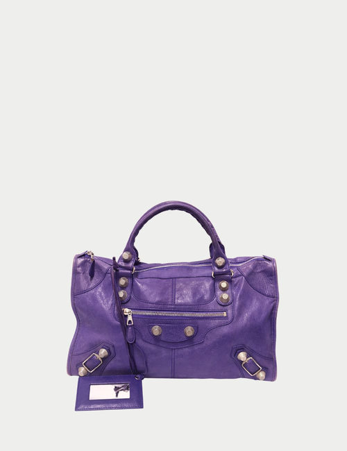 Balenciaga Giant City Bag in purple leather with oversized stud hardware, front zip pocket, and braided top handles
