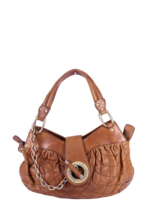 Bally tan quilted leather shoulder bag with chain detail and circular logo hardware, structured slouchy design
