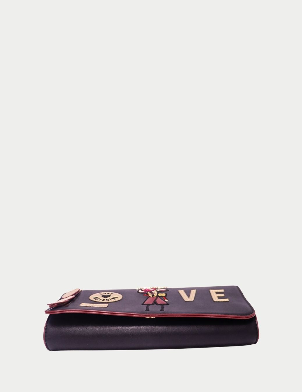 Elevate your style with this Love Moschino black flap handbag, a chic blend of playful design and everyday practicality.
Crafted from smooth faux leather, it features bold appliqué details with the word LOVE and signature logo accents. The structured silh Elevate your style with this Love Moschino black flap handbag, a chic blend of playful design and everyday practicality.
Crafted from smooth faux leather, it features bold appliqué details with the word LOVE and signature logo accents. The structured silh