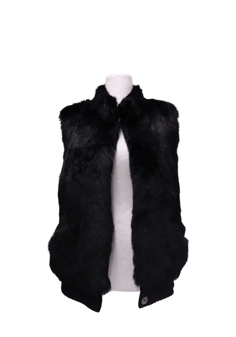 Inès & Maréchal black sleeveless fur vest featuring a plush fur exterior, raised collar, oversized front pockets and ribbed knit hem detailing