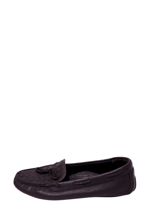 Authentic Bottega Veneta black leather driving loafers featuring the signature Intrecciato woven vamp, leather tassels, and slip-on moccasin silhouette