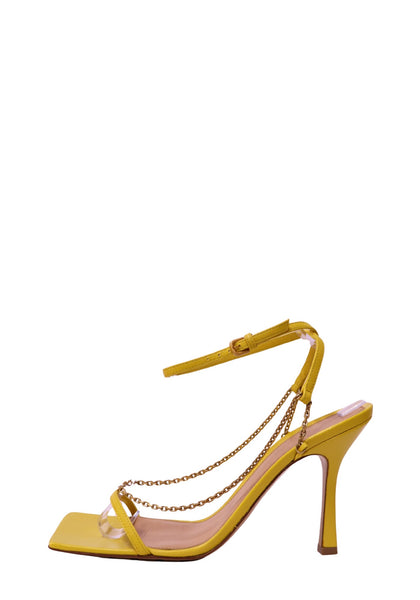 Authentic Bottega Veneta yellow leather heeled sandals with gold-tone chain detailing, square toe, and ankle strap.