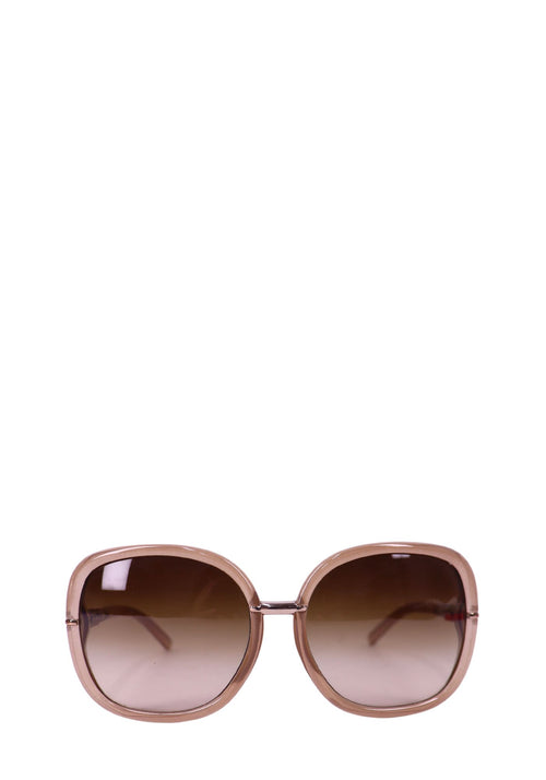 Burberry oversized blush pink sunglasses with gradient brown lenses and rounded square frames.