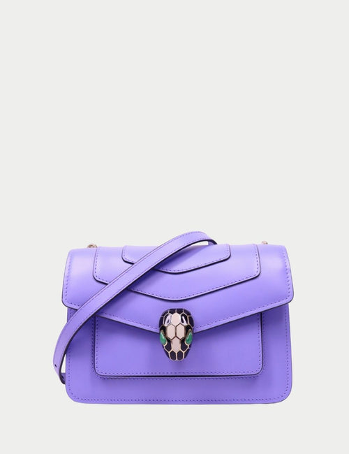 Lavender leather Serpenti Forever shoulder bag by Bvlgari featuring signature snake-head clasp, structured flap design, and adjustable crossbody strap