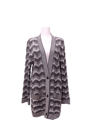 Missoni grey and charcoal chevron patterned longline knit cardigan featuring a deep V-neckline, three-button front closure, long sleeves, ribbed trims, and two front patch pockets