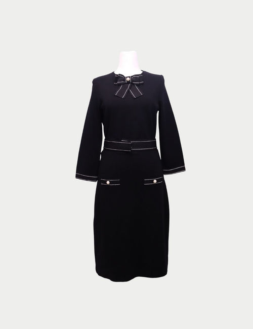 Carolina Herrera black midi dress with bow neckline and pearl details