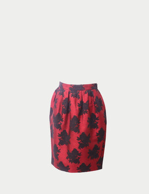 Carolina Herrera red high-waisted skirt with black floral jacquard pattern and pleated detailing