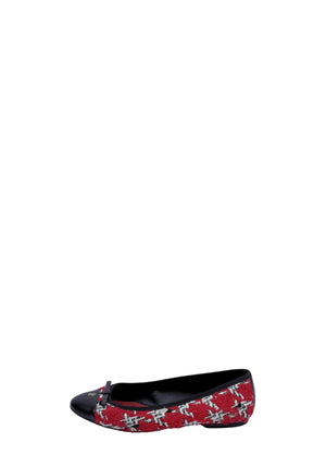 Carolina Herrera ballet flats featuring a red tweed upper, black cap toe, and delicate bow detail