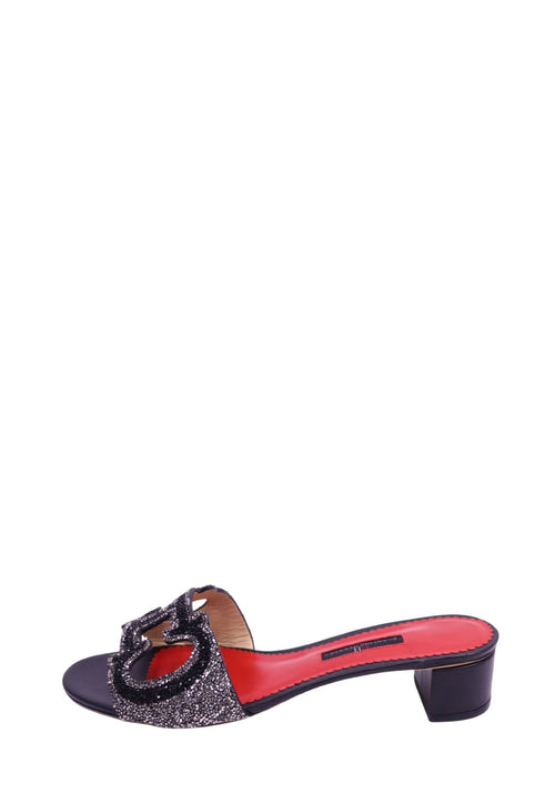 Carolina Herrera black leather slide sandals with crystal CH logo embellishment, block heel, and red leather footbed