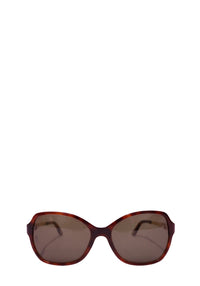 Authentic Cartier tortoiseshell square sunglasses featuring brown tinted lenses, elegant gold-tone metal temples, and a timeless luxury designer silhouette.