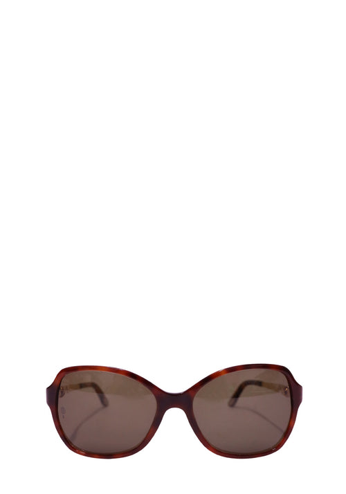 Authentic Cartier tortoiseshell square sunglasses featuring brown tinted lenses, elegant gold-tone metal temples, and a timeless luxury designer silhouette.