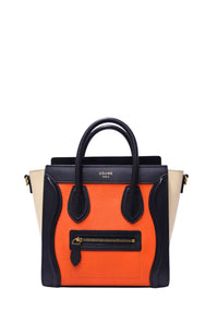 Céline Nano Luggage tricolor leather handbag featuring orange pebbled leather, navy blue trim, cream winged sides, gold-tone hardware and front zipper