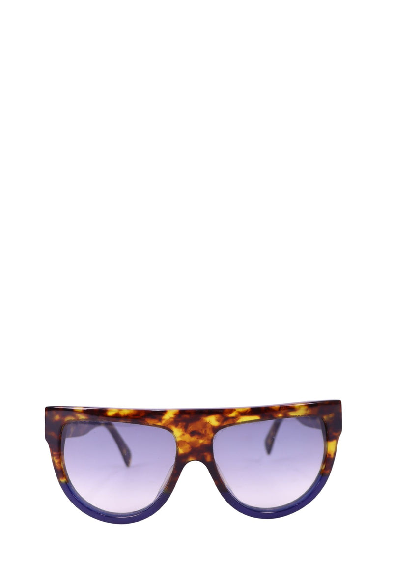 Celine oversized tortoiseshell shield sunglasses with gradient tinted lenses and bold acetate frame.