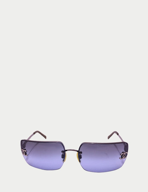 Chanel rimless sunglasses with blue gradient lenses and crystal CC logo on the temples