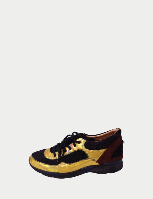 Chanel lace-up sneakers with gold metallic leather panels, black tweed fabric, and brown suede accents