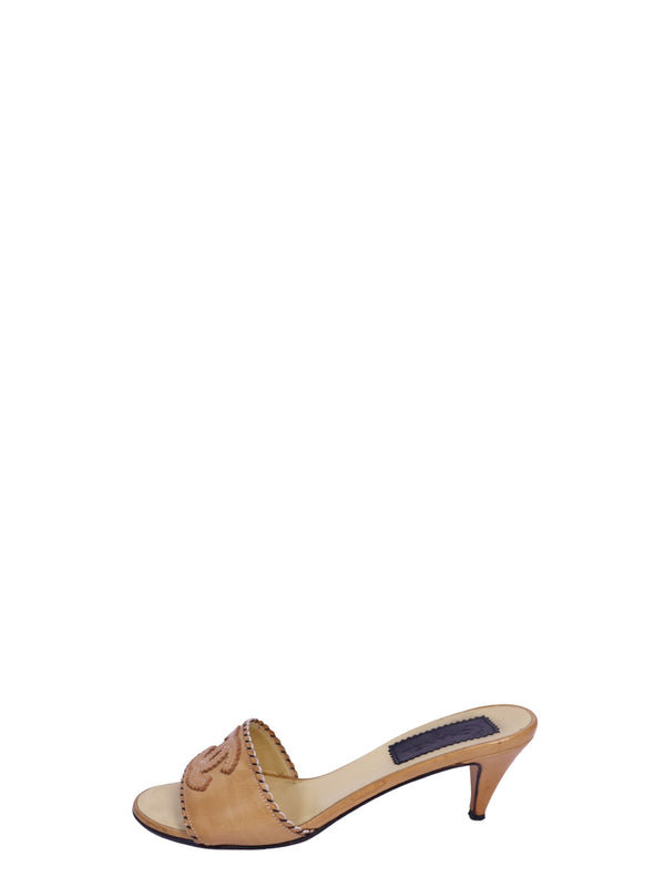 Chanel camel leather mule sandals with embroidered CC logo, contrast whipstitch trim, open-toe design, and kitten heels
