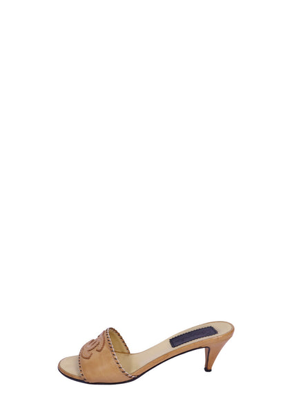 Chanel camel leather mule sandals with embroidered CC logo, contrast whipstitch trim, open-toe design, and kitten heels