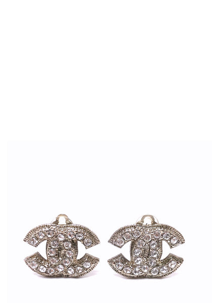 Chanel silver-tone crystal CC clip-on earrings with sparkling rhinestone embellishments.