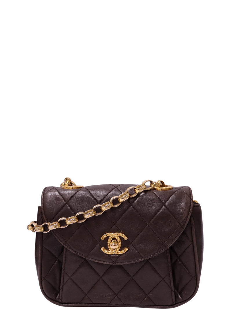Chanel dark chocolate brown quilted leather mini flap handbag with rounded flap, gold-tone CC turn-lock and leather-interwoven chain strap
