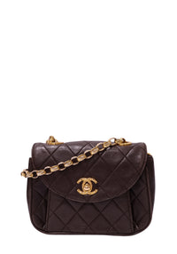 Chanel dark chocolate brown quilted leather mini flap handbag with rounded flap, gold-tone CC turn-lock and leather-interwoven chain strap