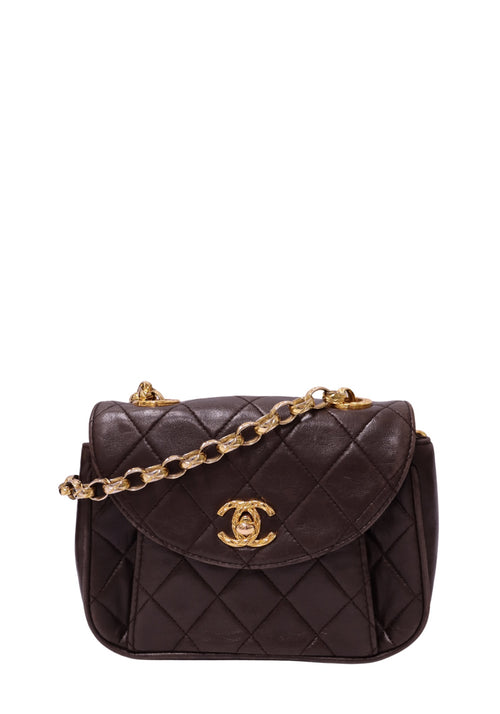 Chanel dark chocolate brown quilted leather mini flap handbag with rounded flap, gold-tone CC turn-lock and leather-interwoven chain strap