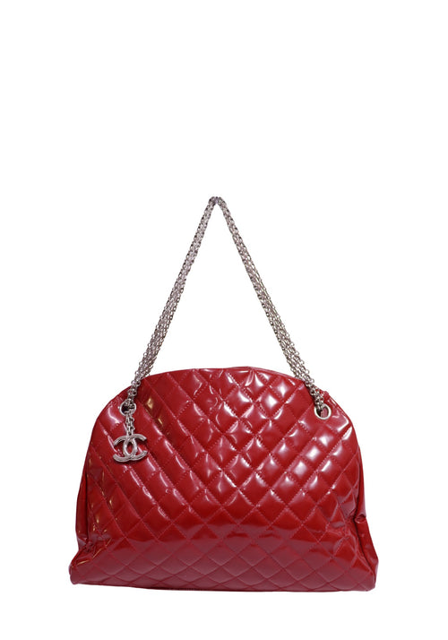 Chanel red patent leather quilted shoulder bag with silver-tone chain straps and CC logo charm.