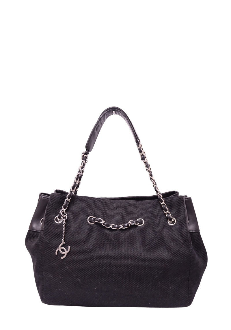 Chanel black woven tote bag with leather trim, silver-tone chain handles and CC charm