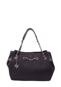 Chanel black woven tote bag with leather trim, silver-tone chain handles and CC charm