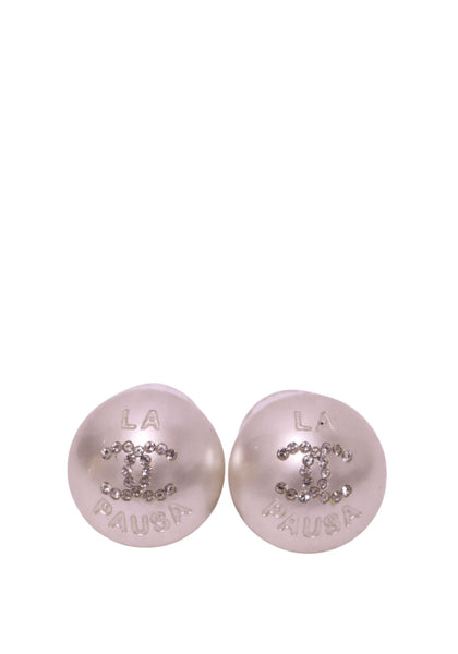 Chanel La Pausa ivory faux pearl stud earrings with crystal interlocking CC logos and embossed lettering