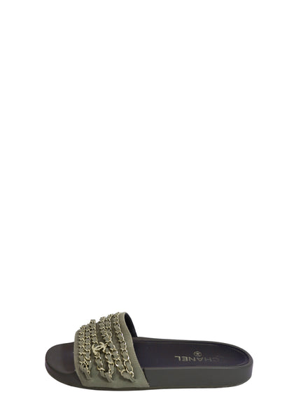 Authentic Chanel khaki green slide sandals featuring wide fabric straps adorned with signature gold-tone chain embellishments, iconic CC logo hardware, and a comfortable slip-on flat design.