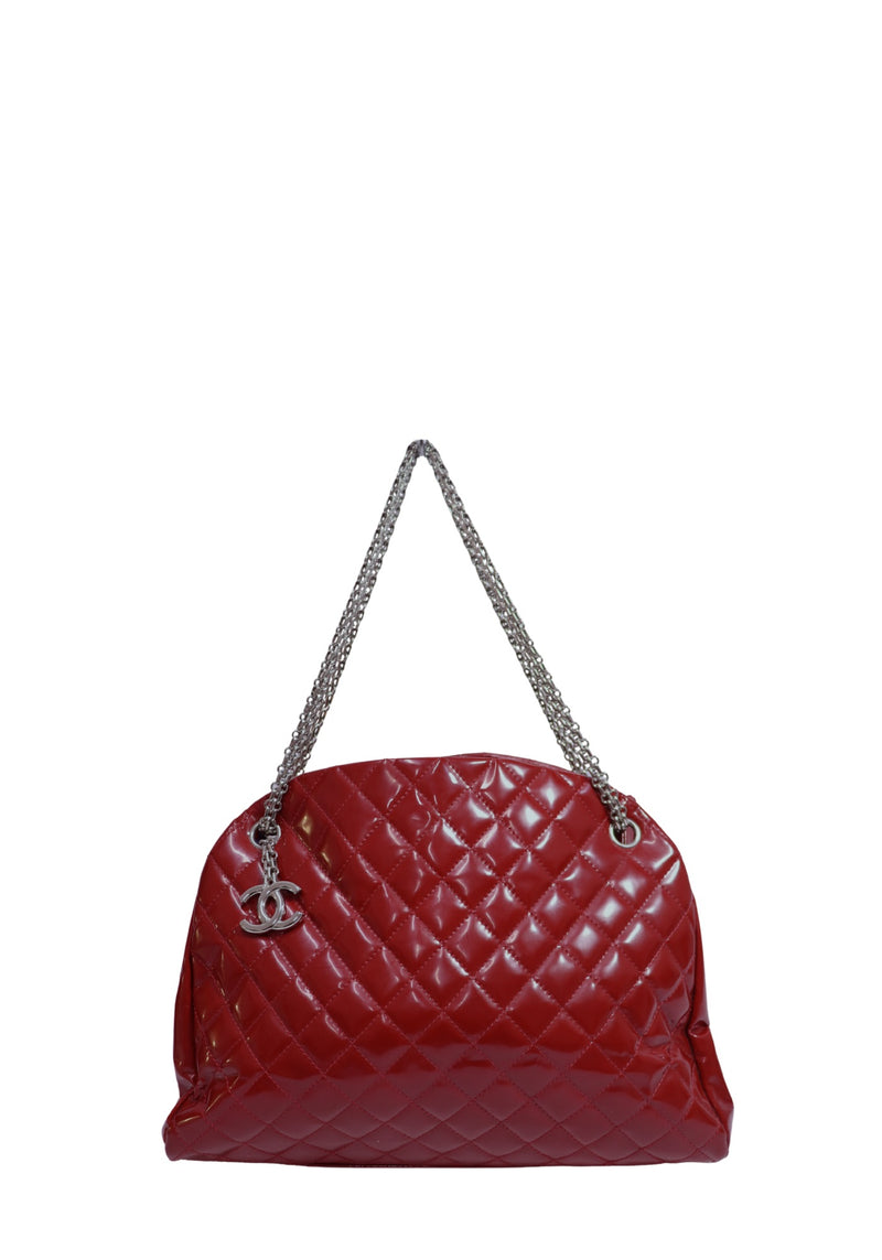 Chanel red patent leather quilted shoulder bag with silver-tone chain straps and CC logo charm.