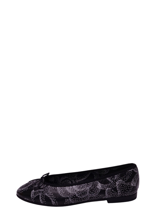 Chanel black leather ballet flat featuring an intricate white dotted abstract pattern, delicate black bow, rounded toe, black trim, and low heel